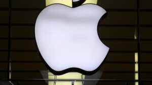 The-Apple-logo-is-illuminated-at-a-store-in-the-city-center-in-Munich-Germany.AP_